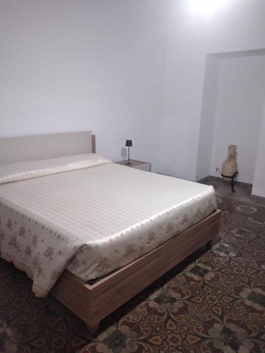 a bed sitting in a room with a mattress at Casa Carolina in Surano