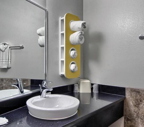 a bathroom with a sink and a mirror at Motel 6-Weslaco, TX in Weslaco
