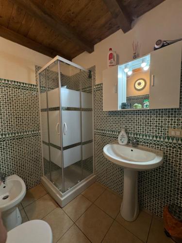 a bathroom with a shower and a sink at Sicilia Bedda Holiday Home in Cinisi