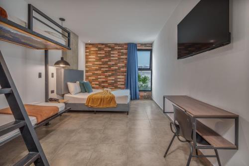 a bedroom with a bunk bed and a loft at Appartments Pool and Rooftop Downtown Hotel in Medellín