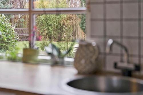 a kitchen counter with a sink and a window at 80320-Ulfborg-Reberbanen-4 in Ulfborg