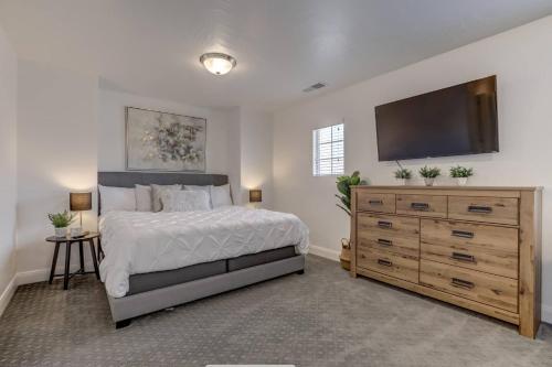a bedroom with a bed and a flat screen tv at Long Stays Welcome! Pet Friendly & Heated Pool in Washington
