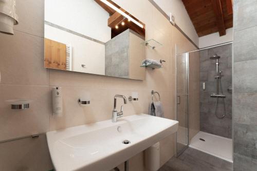 a bathroom with a sink and a shower at Appartement Gehörde-Sölden inklusive Summercard in Sölden