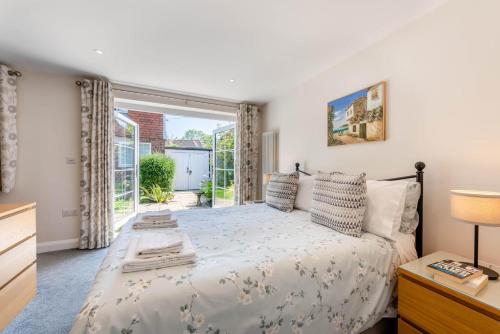 a bedroom with a bed and a large window at 1 Bed in Wadhurst oc-79495 in Ticehurst