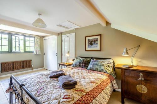 a bedroom with a bed and a wooden dresser at 2 Bed in Minehead oc-77362 in Withypool