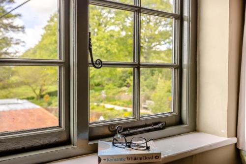 a pair of glasses sitting on a window sill at 2 Bed in Minehead oc-77362 in Withypool