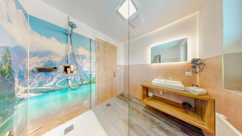 a bathroom with a sink and a mirror at Appartement Belmonte in Sölden