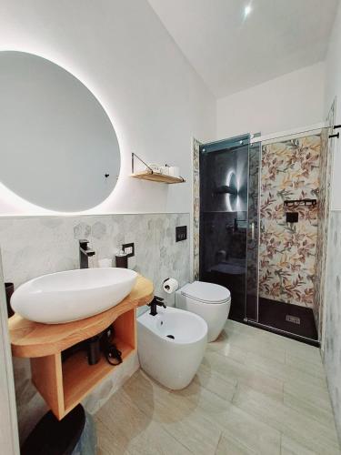 a bathroom with a sink and a toilet and a shower at La Siesta 5 terre in La Spezia