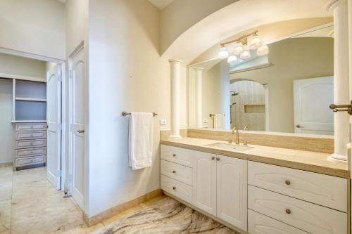 a bathroom with a sink and a mirror at Casa 4 C's in Cabo San Lucas