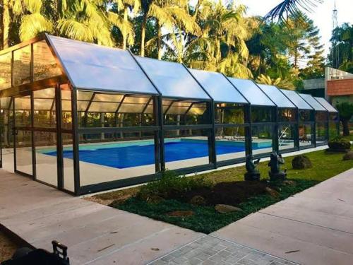 a large glass building with a swimming pool at Spa Tour Life in Montenegro