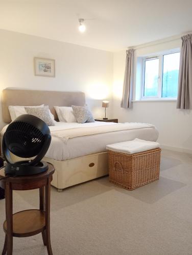 a bedroom with a large bed and a window at Little Paradise Marlborough in Marlborough