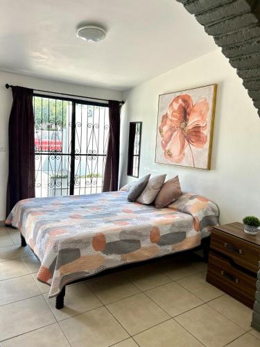 a bedroom with a bed and a window at Estudio #2 a 5 min del malecon in La Paz
