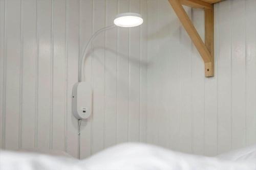 a light on a wall with a phone on it at 2236-Ringkobing-Fladsbjergvej-220 in Klegod