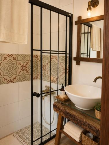 a bathroom with a tub and a sink at Just Datça in Datca