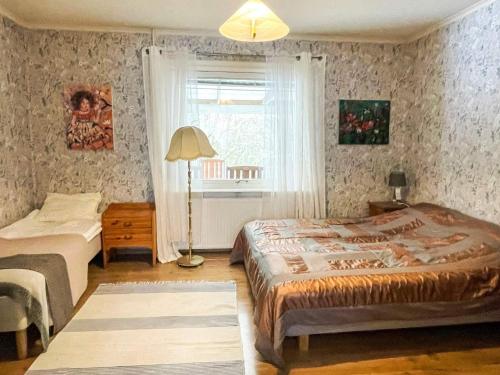 a bedroom with two beds and a window at Holiday Home in Ruda with Terrace in Ruda