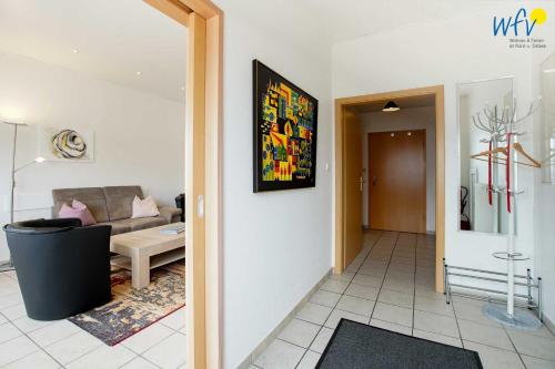 a living room with a couch and a table at Haus Wilhelm-Feldhoff Ferienwohnung Veen in Borkum