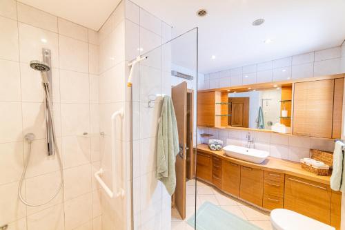 a bathroom with a shower and a sink at Moar Apartments in Silandro