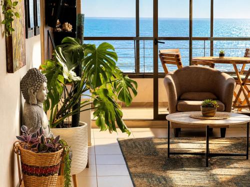 a living room with a view of the ocean at NORTHSUITE - Vista al Mar - 3 Dormitorios - Parking in Antofagasta