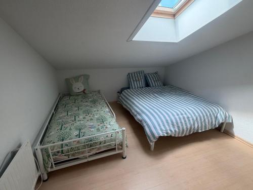 a small bedroom with a bed and a bed sqor at 225 rue de la source in Bretignolles-sur-Mer