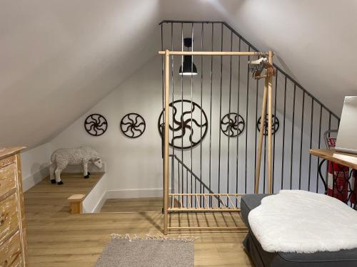a room with a staircase with a zebra on the wall at Cosy nap under the Paps in Killarney