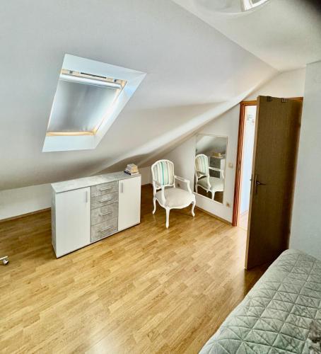 a bedroom with a bed and a dresser and a mirror at Villa Oliva Korcula in Korčula