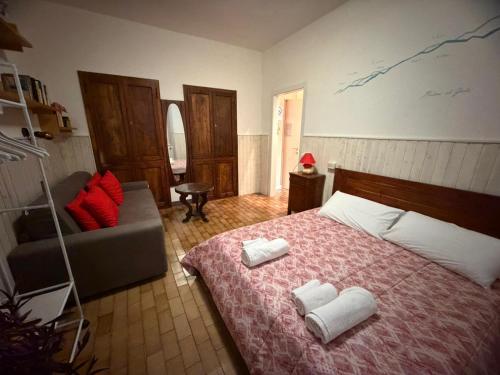 a bedroom with a bed with two towels on it at Bellagio, Como Lake Breva - Como Lake in Bellagio