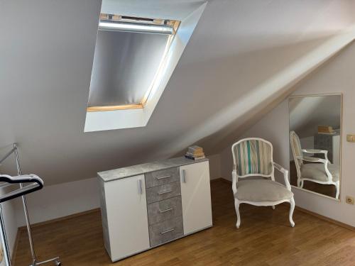 a white room with a mirror and a chair at Villa Oliva Korcula in Korčula