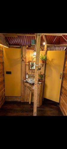 an open door to a kitchen with a table at TANGARA Hostel in Buenaventura