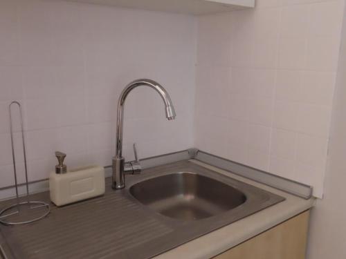 a kitchen sink with a faucet on top of it at Forest Calm Faliraki in Faliraki