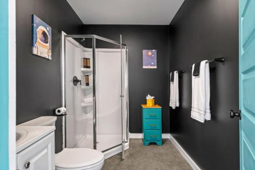 a bathroom with a white toilet and a shower at Stargazer Dome Retreat in San Marcos