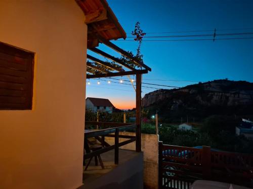 a view of the sunset from the balcony of a house at Chalé Mandacaru in Monte das Gameleiras