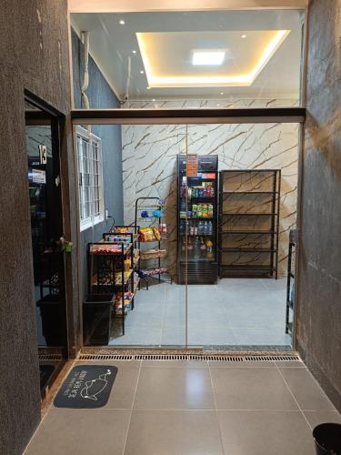 a view of a shop from the inside of the door at FlatsMedrado Hotel in Confresa