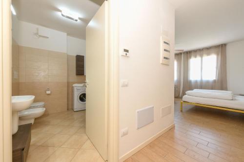 a bathroom with a toilet and a sink at Baldo View Studio in Toscolano Maderno