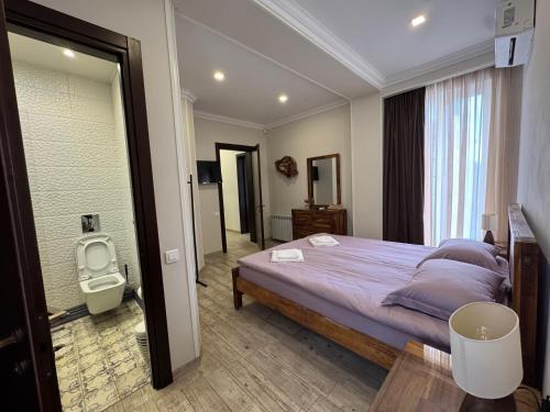 a bedroom with a large bed and a window at RestCoast Villa in Shekhvetili