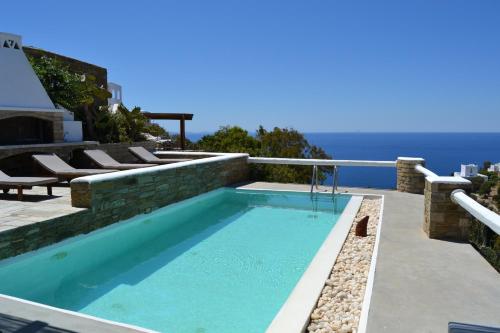 a swimming pool with a view of the ocean at Villa Giulia, Seaview Villa near Chora in Ios Chora