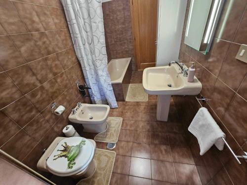 a bathroom with a toilet and a sink at Nido Urbano Roma in Rome