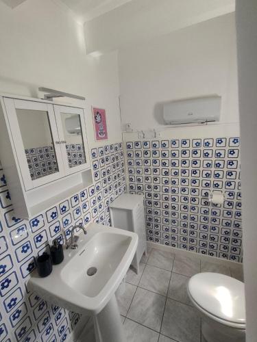 a bathroom with a sink and a toilet at la crique in Sisco