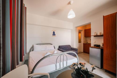 a hospital room with a bed and a kitchen at Kalpazo Rental Kaya Stays in Golem