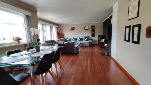 a living room with a table and a couch at Stryn Norway in Stryn