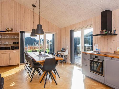 a kitchen with a table and chairs in a room at 5 star holiday home in Haderslev in Haderslev
