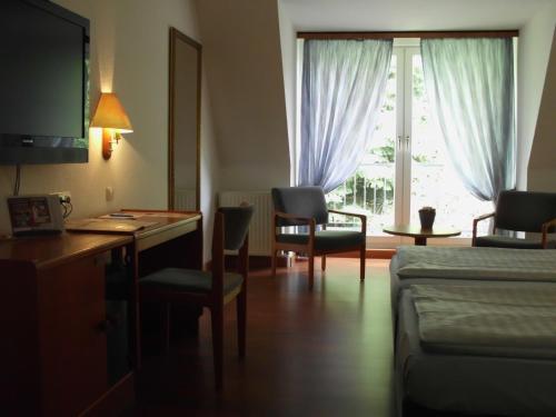 Postel nebo postele na pokoji v ubytování Hotel Heidpark