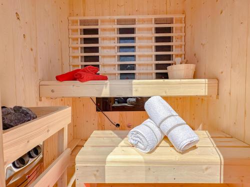 a wooden cabin with two bunk beds in it at Landzicht in Haps
