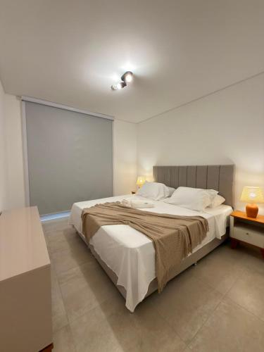a bedroom with a large bed in a room at Feel Premiun 2408 in Asunción