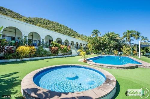 a large swimming pool in the middle of a yard at 71 Mandalay in Nelly Bay