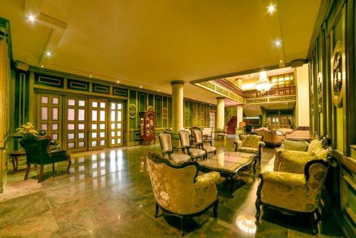 a large living room with chairs and a table at Chtaura Park Hotel in Chtaura