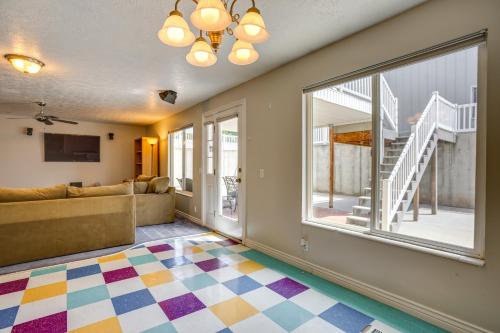 a living room with a couch and a window at Easy AFB Commute! Clearfield Unit w/ Private Patio in Clearfield