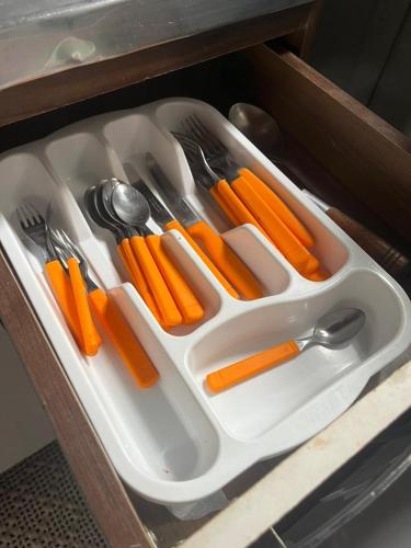 a white tray filled with carrots and utensils at Casa proximo parque in Santa Rosa