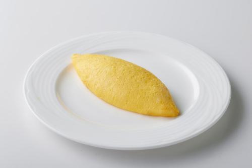 a cookie sitting on a white plate at Hotel New Otani Hakata in Fukuoka
