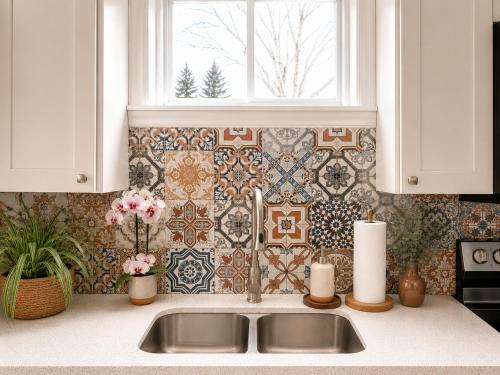 a kitchen counter with a sink and a window at Chic & Spacious 2BR Home Near Yonge St in Newmarket