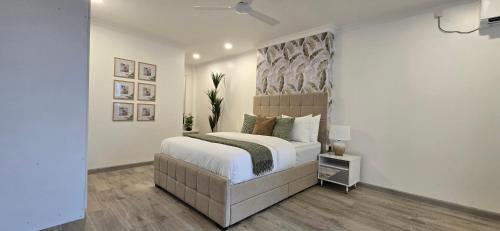 a bedroom with a large bed in a room at Nala Host - Maafushi Homes in Maafushi